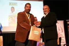 Eddy-Kimani-receives-a-gift-hamper-from-Mehboob-Nanji-after-the-panel-session-on-motorsport