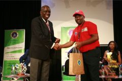 John-Ohaga-receives-gift-hamper-from-John-Muli-after-the-panel-session-on-sports-arbitration