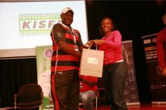 Edward-Rombo-receives-gift-hamper-from-Mary-Muriuki