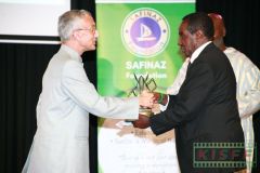H.E. Mr. Rahul Chhabra, High Commissioner of India to Kenya receives an award for best long documentary Project Wild Woman from Kenyan Veteran journalist Sammy Lui, MBS, during the KISFF2019 awards gala