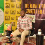 Journalist, Mr. David Kwalima readies himself for his Interview Session with Mr. Hussein Mohammed, CEO, Extreme Sports and Founder of The Award Winning Super 8 Grassroots Football League.