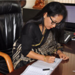 The Indian High Commissioner to Kenya, Madam Namgya. C. Khampa Signing The Official KISFF, Visitors Book.